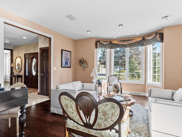 living room with wood finished floors and baseboards