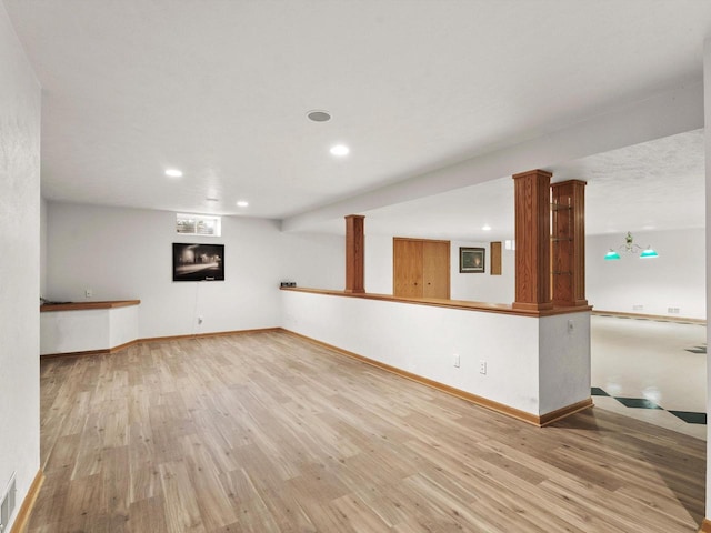 unfurnished living room featuring recessed lighting, baseboards, visible vents, and light wood finished floors