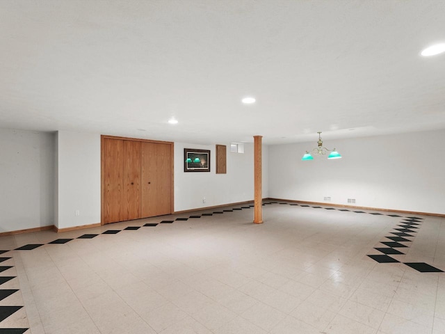 garage with recessed lighting and baseboards