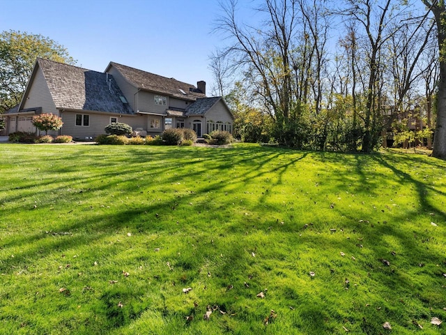 view of yard featuring a garage