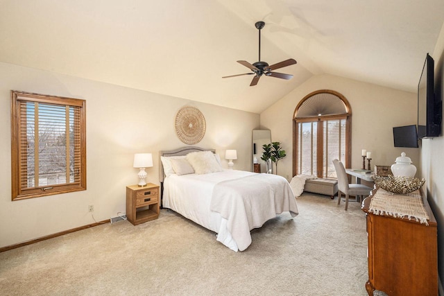 bedroom with light carpet, baseboards, a ceiling fan, and lofted ceiling