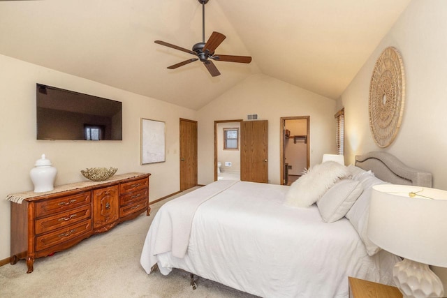 bedroom with ensuite bathroom, light colored carpet, a ceiling fan, visible vents, and vaulted ceiling