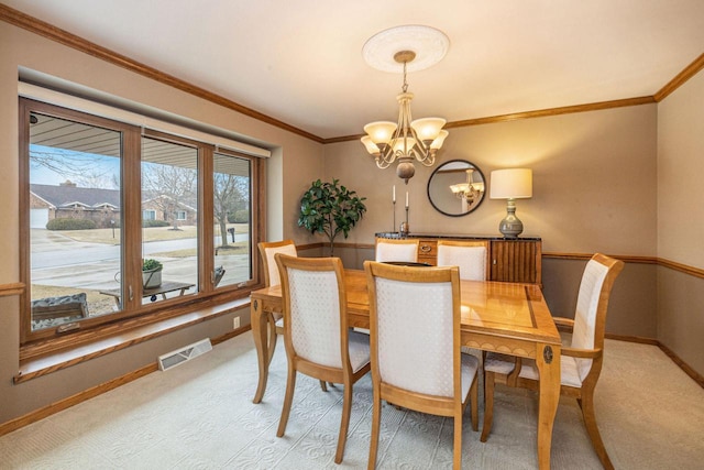 dining area with light carpet, an inviting chandelier, baseboards, and visible vents