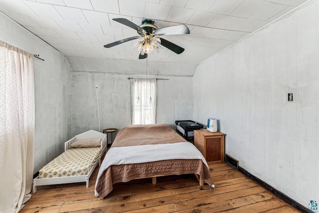 bedroom featuring visible vents, ceiling fan, and hardwood / wood-style floors