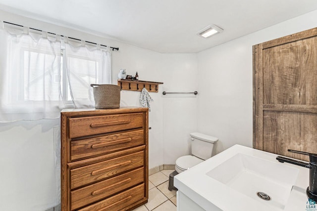 bathroom with visible vents, vanity, toilet, and tile patterned floors