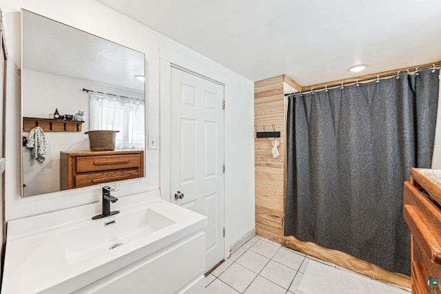 bathroom featuring a shower with shower curtain, tile patterned flooring, and vanity