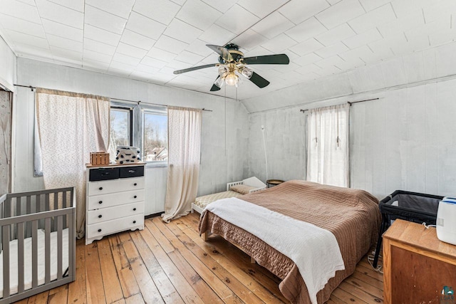 bedroom featuring a ceiling fan and light wood-style floors