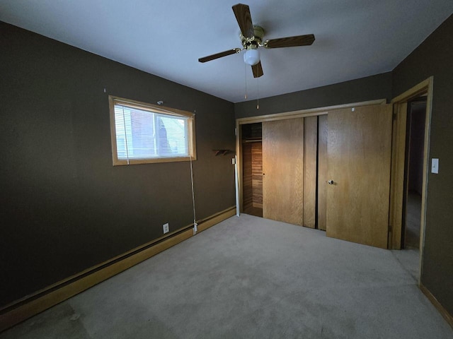 unfurnished bedroom featuring carpet floors, a ceiling fan, and a closet