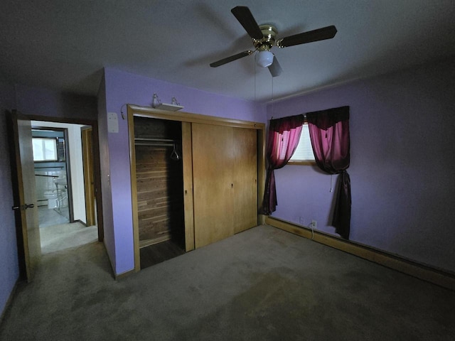 unfurnished bedroom featuring a closet, carpet flooring, and a ceiling fan