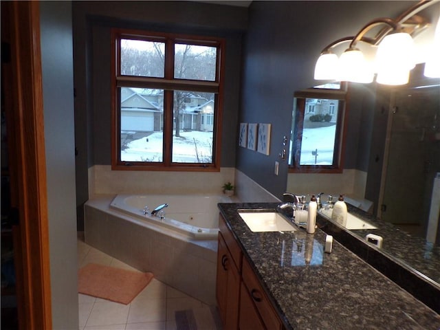 full bath with vanity, tile patterned floors, and a jetted tub