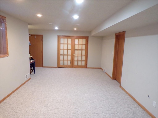 carpeted empty room featuring visible vents, recessed lighting, french doors, and baseboards