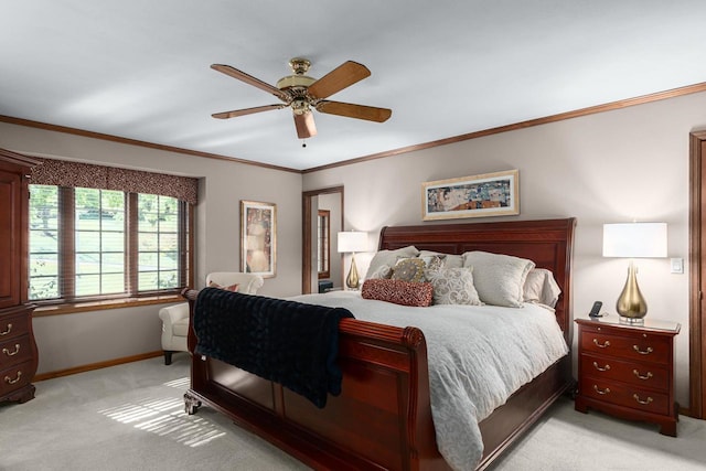 bedroom with ceiling fan, light colored carpet, baseboards, and ornamental molding