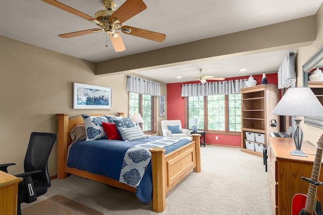 bedroom with light carpet, ceiling fan, and baseboards