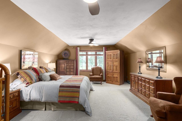 bedroom with light colored carpet, ceiling fan, and vaulted ceiling