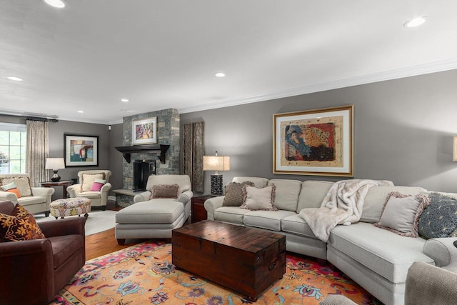 living area with crown molding, recessed lighting, and wood finished floors