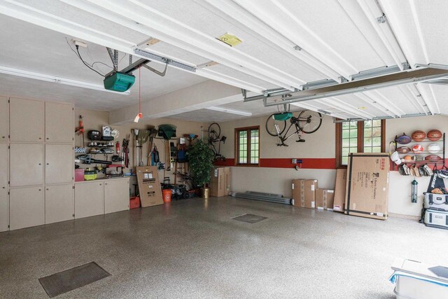 garage featuring a garage door opener