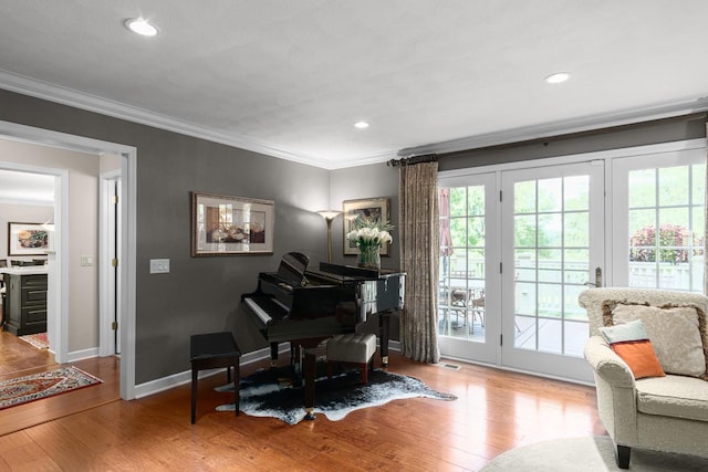 sitting room with recessed lighting, baseboards, ornamental molding, and hardwood / wood-style flooring