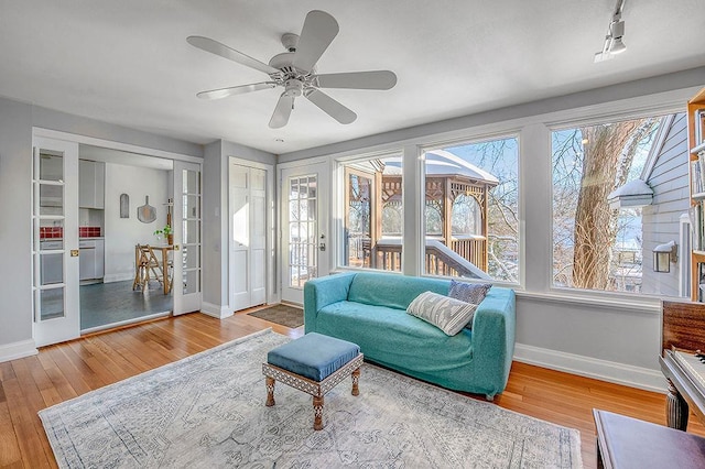 interior space featuring french doors and ceiling fan