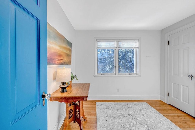 office with light wood-type flooring and baseboards