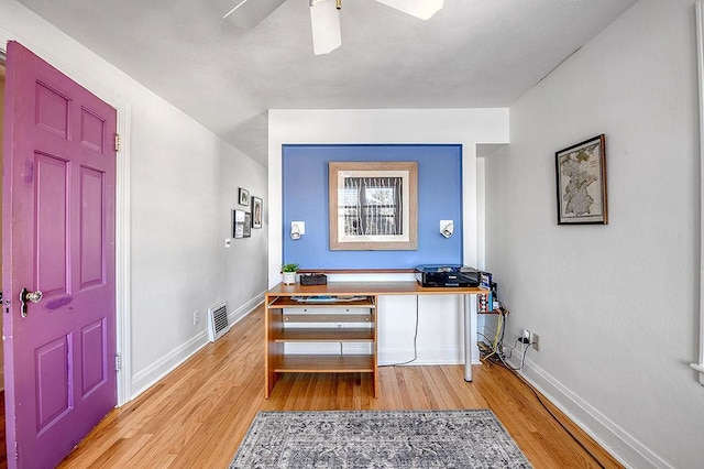 entrance foyer with visible vents, ceiling fan, light wood-type flooring, and baseboards