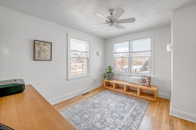 interior space with visible vents, a healthy amount of sunlight, and light wood finished floors