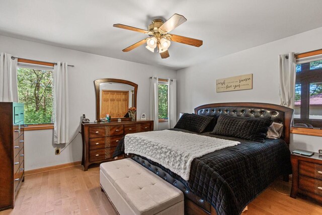 1680 N Aurora Ln, Nekoosa, WI 54457 - bedroom with light wood-style flooring, a ceiling fan, and baseboards