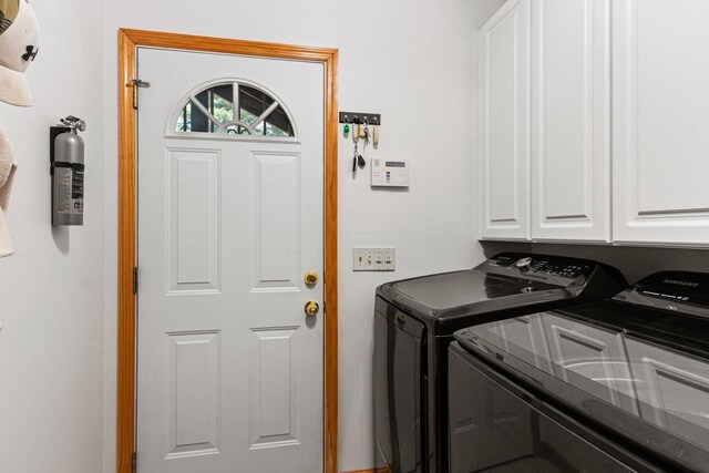 1680 N Aurora Ln, Nekoosa, WI 54457 - washroom with washing machine and clothes dryer and cabinet space