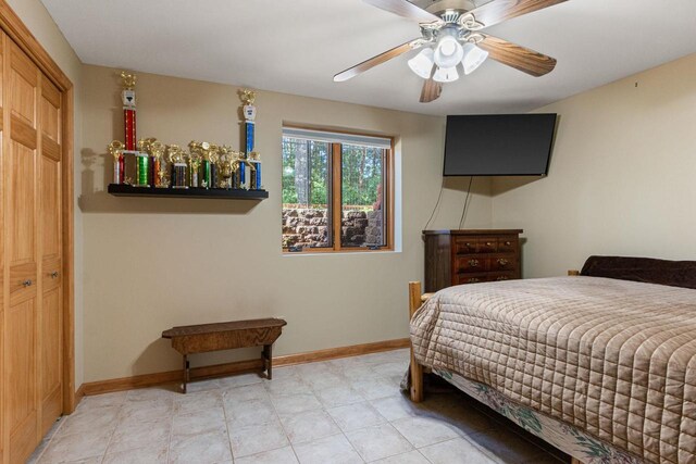 1680 N Aurora Ln, Nekoosa, WI 54457 - bedroom featuring a closet, baseboards, and ceiling fan