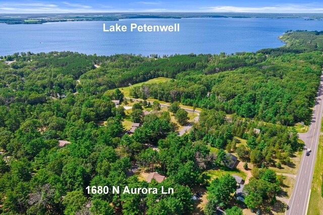 1680 N Aurora Ln, Nekoosa, WI 54457 - drone / aerial view with a water view and a wooded view
