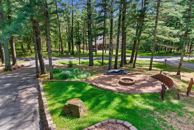 1680 N Aurora Ln, Nekoosa, WI 54457 - view of property's community with an outdoor fire pit and a yard