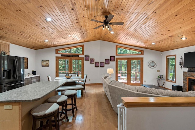 1680 N Aurora Ln, Nekoosa, WI 54457 - living area featuring vaulted ceiling, french doors, light wood-style floors, and wooden ceiling