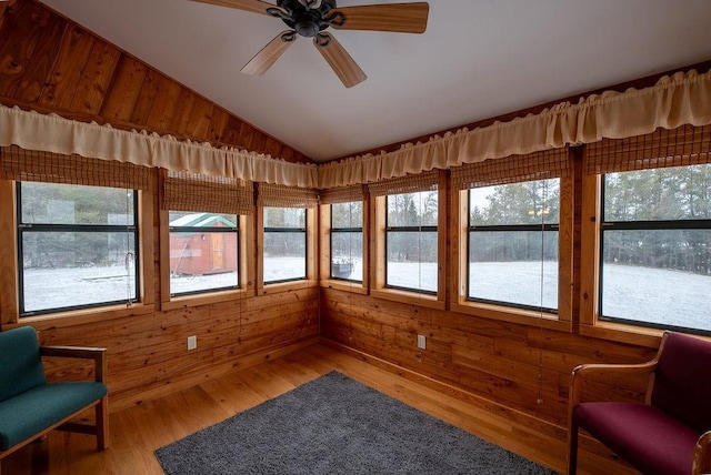 sunroom featuring a wealth of natural light, ceiling fan, and vaulted ceiling