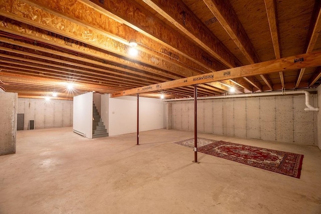 unfinished basement featuring stairway