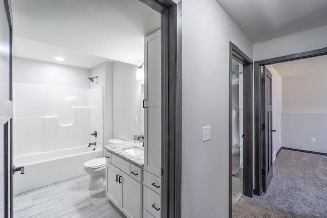 bathroom featuring vanity, toilet, and bathtub / shower combination