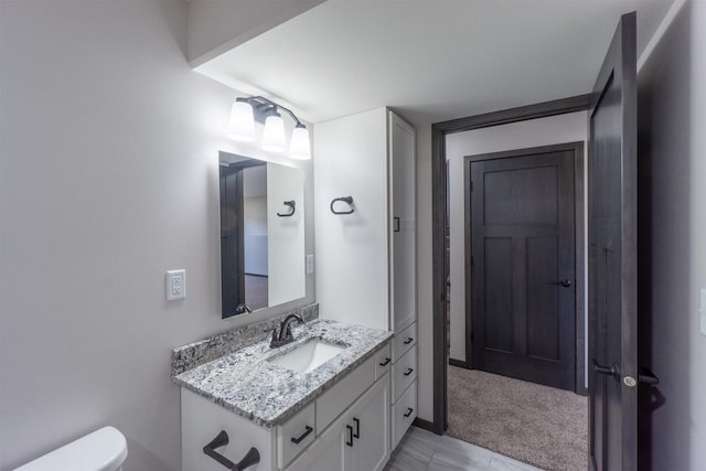 half bath with vanity and toilet