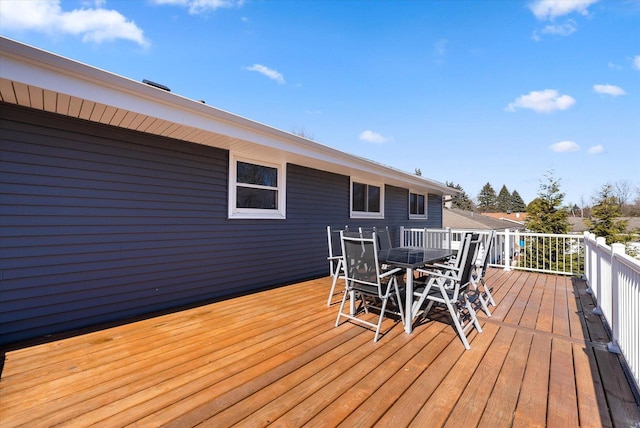 wooden terrace with outdoor dining area