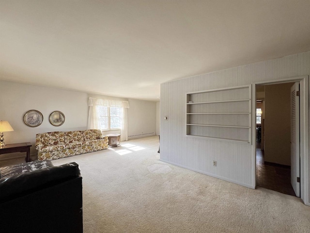 carpeted living room featuring a baseboard heating unit