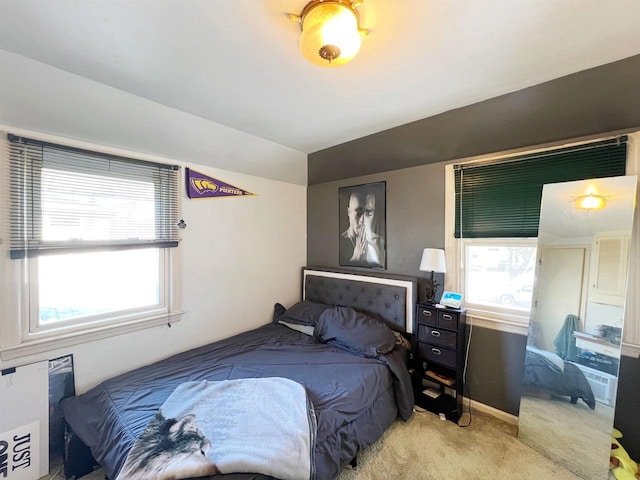 bedroom with vaulted ceiling and carpet