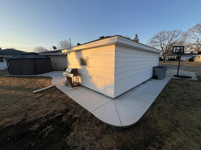 view of property exterior featuring a gazebo and a patio area