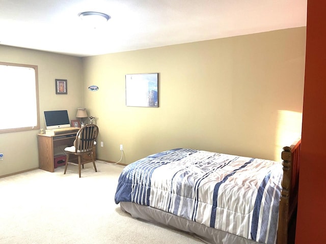 bedroom with carpet and baseboards