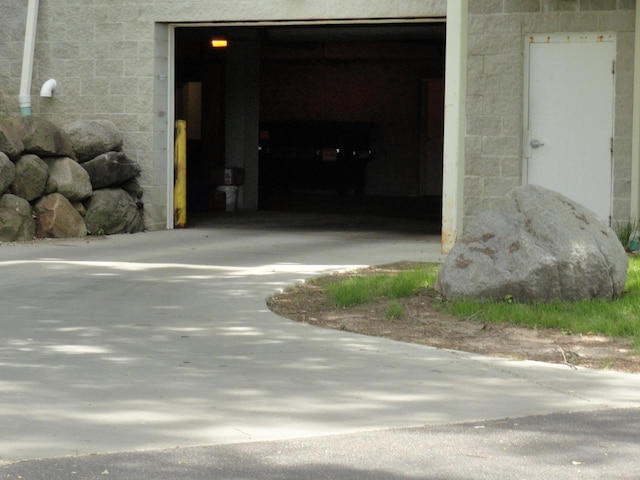 exterior space with concrete driveway