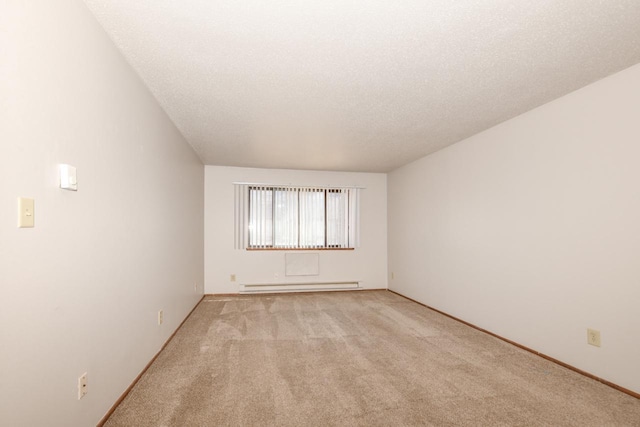 unfurnished room with a baseboard radiator, light carpet, and a textured ceiling