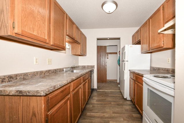 kitchen featuring brown cabinetry, dark wood-style floors, a sink, under cabinet range hood, and white range with electric stovetop