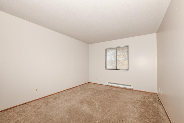 unfurnished room featuring a textured ceiling, carpet flooring, baseboards, and a baseboard radiator