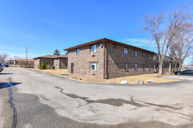 exterior space with brick siding