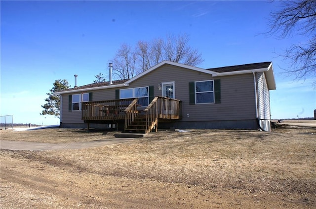 view of front of property with a wooden deck