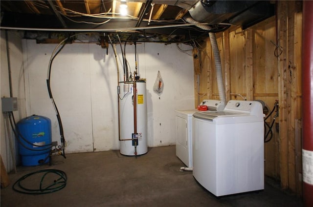 unfinished basement featuring washer and dryer and water heater