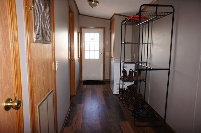 interior space with visible vents, ornamental molding, and hardwood / wood-style flooring