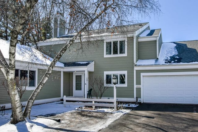 view of front of home featuring driveway and a garage