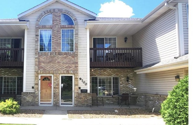 exterior space with brick siding